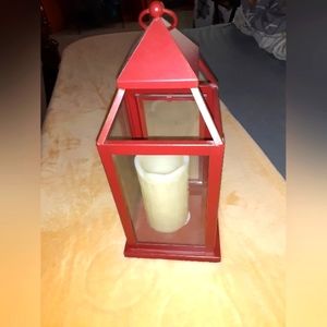 Red metal lantern box with battery candle